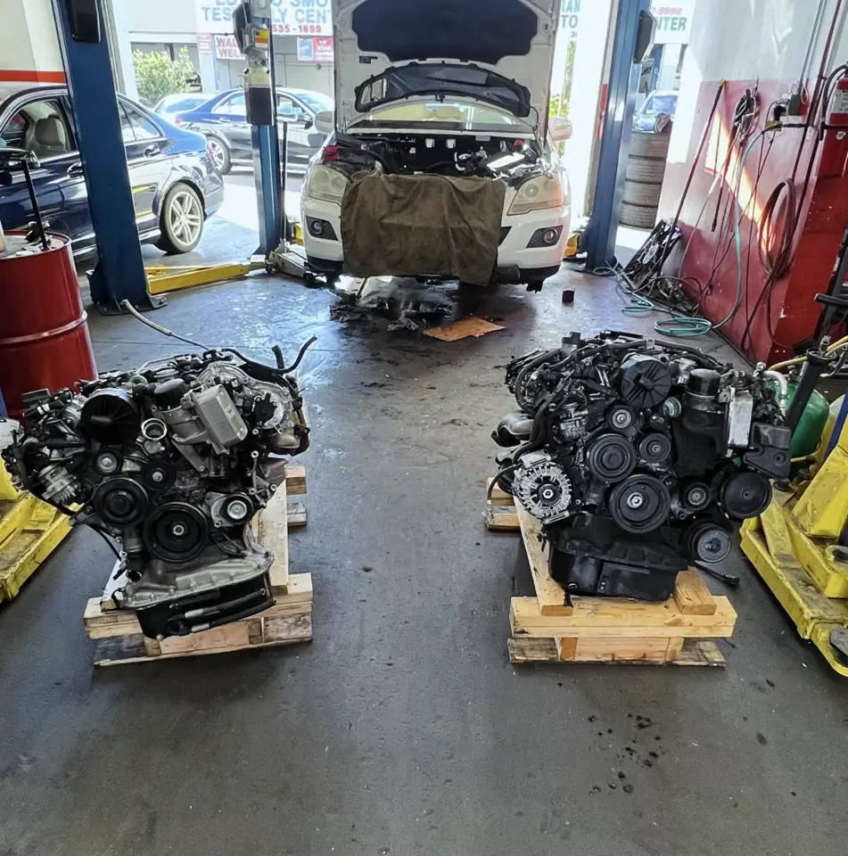 Replacement engines on the floor at La Mesa Autoworks auto repair shop in La Mesa, California